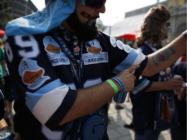"Argo Lifer" John Granger wears his heart on his sleeve – or, forearm, as it were – before the Redblacks' home opener at TD Place on Friday, July 18, 2014.