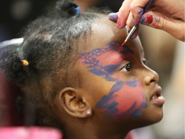 Asli Hussein has her face painted during Eid celebrations held at the EY Centre in Ottawa, July 28, 2014.