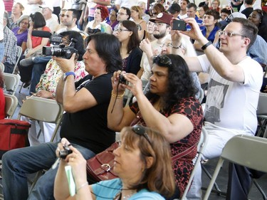 Audience members record the performance of the Ottawa Sri Lankan dance group at the Carnival of Cultures at City Hall in Ottawa on Saturday, July 5, 2014.