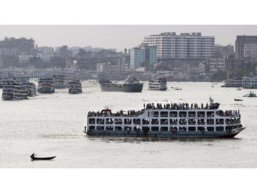 Bangladeshi Muslims travel home on ferries ahead of Eid al-Fitr in Dhaka, Bangladesh, Saturday, July 26, 2014. Eid al-Fitr marks the end of Ramadan, the Muslim calendar's holiest month, during which followers abstain from food and drink from dawn to dusk.