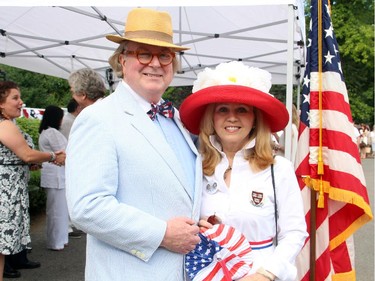Barry McLoughlin and Laura Peck attend the U.S. Embassy's Independence Day party wearing their best red, white and blue on Friday, July 4, 2014.