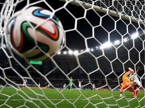 Rais M'Bolhi of Algeria fails to save a shot by Andre Schuerrle of Germany (not pictured) for Germany's first goal in extra time during the 2014 FIFA World Cup Brazil Round of 16 match between Germany and Algeria at Estadio Beira-Rio on June 30, 2014 in Porto Alegre, Brazil.