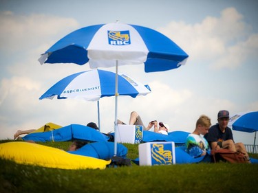 Bluesfest fans take a rest in the RBC bean bags on the hill outside of the Canadian War Museum Sunday July 6, 2014.