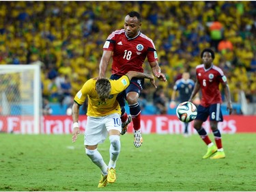 FORTALEZA, BRAZIL - JULY 04:  Neymar of Brazil is challenged by Juan Camilo Zuniga of Colombia during the 2014 FIFA World Cup Brazil Quarter Final match between Brazil and Colombia at Castelao on July 4, 2014 in Fortaleza, Brazil.  This tackle resulted in injury to Neymar and ended the player's World Cup.