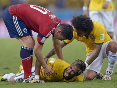 Brazil's Neymar screams out after being fouled during the World Cup quarterfinal soccer match between Brazil and Colombia at the Arena Castelao in Fortaleza, Brazil, Friday, July 4, 2014. Brazil's team doctor says Neymar will miss the rest of the World Cup after breaking a vertebrae during the team's quarterfinal win over Colombia.