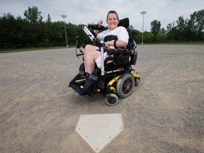 Bryce Desrochers, 11, who was born with cerebral palsy at Notre Dame Deschamps Park home plate.