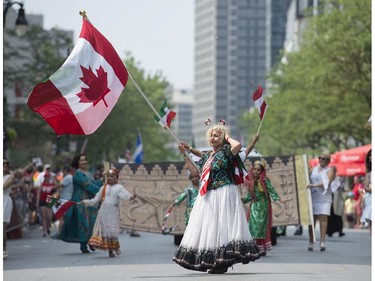 Members of the Iranian community entertain the crowd during the annual Canada Day parade in Montreal, Tuesday, July 1, 2014.