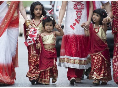 Members of the Indian community entertain the crowd during the annual Canada Day parade in Montreal, Tuesday, July 1, 2014.