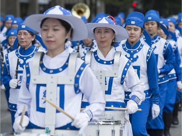 Costumed participants entertain the crowd during the annual Canada Day parade in Montreal, Tuesday, July 1, 2014.