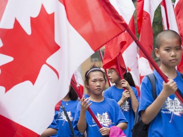 Members of the Chinese community participate in the annual Canada Day parade in Montreal, Tuesday, July 1, 2014.