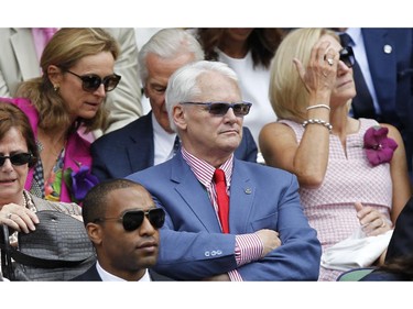 Canada's High Commissioner to London Gordon Campbell, center, sits in the Royal Box on centre court prior to the women's singles final between Eugenie Bouchard of Canada and Petra Kvitova of the Czech Republic at the All England Lawn Tennis Championships in Wimbledon, London, Saturday July 5, 2014.