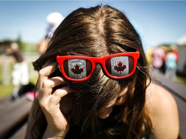 Canadian flag glasses adorn a teenager during Canada Day celebrations in Cremona, Alta., Tuesday, July 1, 2014.