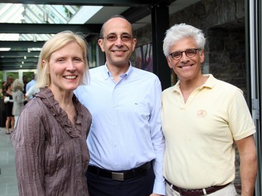 Carleton University president Roseann Runte with Rafik A. Goubran, dean of the Faculty of Engineering and Design, and lawyer Jacques Shore, former chair of the university's board of governors, at the Youth Summit Soirée hosted by Michael Potter on Monday, June 30, 2014, with special guest Chris Hadfield and the Canadian Forces Snowbirds.