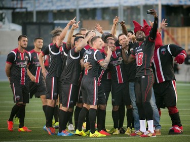 Carlton Mitchell takes a selfie with the Ottawa Fury FC during the official opening of TD Place at Lansdowne Wednesday July 9. 2014.