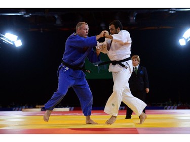 **Correction - NB. Editor's this is Bronze medal match, not Gold** New Zealand's bronze medalist Tim Slyfield (L) fights India's Sahil Pathania (R) in the men's 100kg judo at the SECC Precinct during the 2014 Commonwealth Games in Glasgow, Scotland on July 26, 2014.