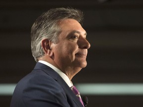 Ontario Finance Minister Charles Sousa speaks to reporters before delivering the 2014 budget at Queen's Park in Toronto on Monday, July 14, 2014.