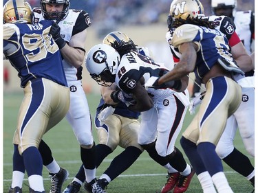 Ottawa Redblacks' Chevon Walker (29) runs the ball in for their first touchdown during the first half of CFL action against the Winnipeg Blue Bombers in Winnipeg Thursday, July 3, 2014.