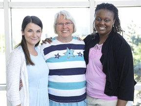 City councillor Marianne Wilkinson (centre) and Head Start participants Ahiney Laryea (R), Jasmin Goldstein (L) are photographed at the Ottawa City Hall on July 24, 2014. (James Park / Ottawa Citizen)