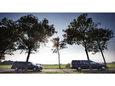 The column of funeral hearses drive near Nieuwegein after leaving the airbase in Eindhoven to Hilversum on July 26, 2014, on the fourth day of the airlift with a Dutch Air Force C-130 Hercules plane and an Australian Royal Australian Air Force C17 transport plane with bodies of the 298 victims of the Malaysia Airlines MH17 plane crash in eastern Ukraine.