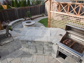 Gourmet kitchen by Outdoor Kitchens and Patios.