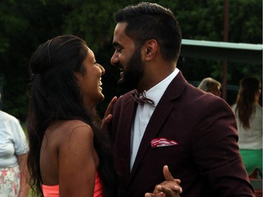 Cyandra Carvalho and Yohan Rodericks sneak some romantic dancing on the greens of the Elmdale Lawn Bowling Club on Wednesday, July 2, 2014, during a fundraiser for cystic fibrosis.