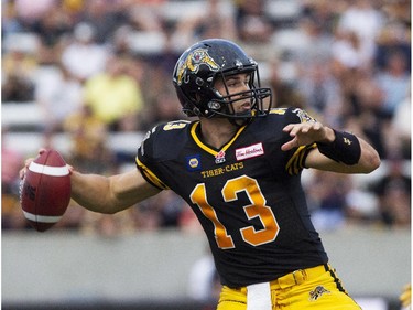 Hamilton Tiger-Cats quarterback Dan LeFevour looks to make a pass during their home opener against the Ottawa RedBlacks in CFL action in Hamilton, Ont., Saturday, July 26, 2014.