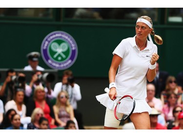 Petra Kvitova of Czech Republic celebrates during the Ladies' Singles final match against Eugenie Bouchard of Canada on day twelve of the Wimbledon Lawn Tennis Championships at the All England Lawn Tennis and Croquet Club on July 5, 2014 in London, England.