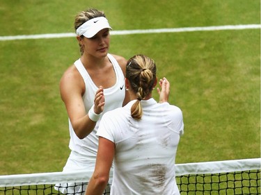 Petra Kvitova of Czech Republic is congratulated by Eugenie Bouchard of Canada after the Ladies' Singles final match on day twelve of the Wimbledon Lawn Tennis Championships at the All England Lawn Tennis and Croquet Club on July 5, 2014 in London, England.