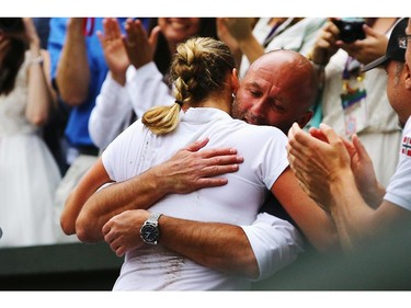 Petra Kvitova of Czech Republic hugs her coach David Kotyza as she celebrates winning the Ladies' Singles final match against Eugenie Bouchard of Canada on day twelve of the Wimbledon Lawn Tennis Championships at the All England Lawn Tennis and Croquet Club on July 5, 2014 in London, England.