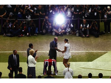 Petra Kvitova of Czech Republic receives the Venus Rosewater Dish trophy from Prince Edward, Duke of Kent after her victory in the Ladies' Singles final match against Eugenie Bouchard of Canada on day twelve of the Wimbledon Lawn Tennis Championships at the All England Lawn Tennis and Croquet Club on July 5, 2014 in London, England.