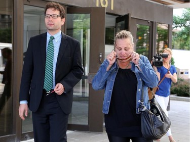 Devontay Hackett's lawyer Joseph Addelman (left) and mom leave the Elgin Street courthouse, Ottawa, Saturday, July 12, 2014. Hackett is accused of killing Brandon Volpi. He was arrested in Toronto yesterday (Friday) and made his first court appearance this morning via video.