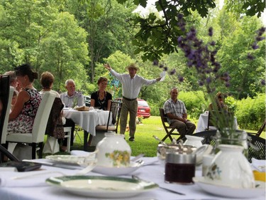 Don Walsh, who co-hosted the High Tea for Ryan's Well Foundation with his wife, Robin Stewart, addresses the crowd at their Plaisance, Que. property on Sunday, July 20, 2014.