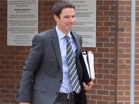 Defence lawyer Jeff Ayotte leaves court during a recess in the trial of MP Dean Del Mastro and co-accused Richard McCarthy in Peterborough, Ontario on Monday June 23, 2014.