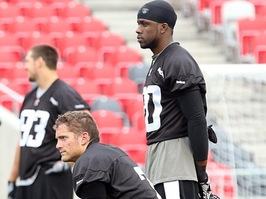 Eric Fraser takes a knee while waiting his turn on a drill as the Ottawa Redblacks have their first practice at home since losing their opening season game against Winnipeg.