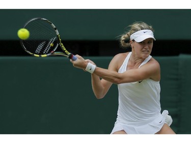 Eugenie Bouchard of Canada plays a return to Petra Kvitova of Czech Republic during the women's singles final at the All England Lawn Tennis Championships in Wimbledon, London, Saturday, July 5, 2014.