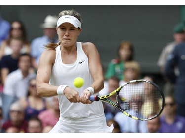 Eugenie Bouchard of Canada plays a return to Petra Kvitova of the Czech Republic during the women's singles final at the All England Lawn Tennis Championships in Wimbledon, London, Saturday July 5, 2014.