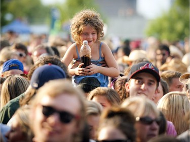 Fans get excited before Tim Hicks hit the stage Sunday July 6, 2014 at Bluesfest held at LeBreton Flats.