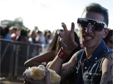 Fans like Valentin Badrieh lined up to be in the front row for the Lady Gaga concert at the RBC Ottawa Bluesfest, July 5, 2014.