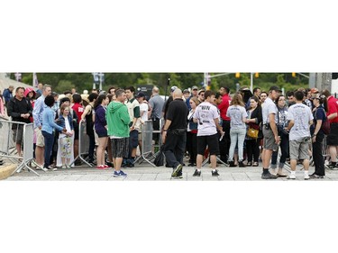 Fans line up to get in at Bluesfest opening night Thursday, July 3, 2014.