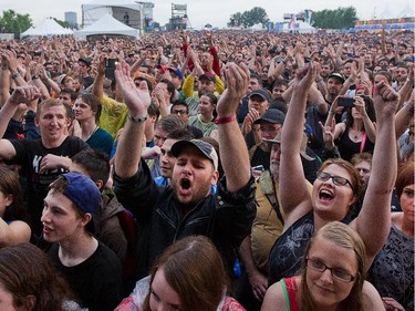 Fans of the band Queens of the Stone Age react has they walk on the Claridge Stage at Bluesfest.