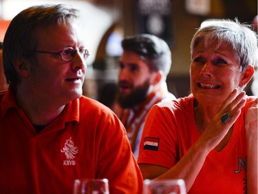 Fans react as they watch the FIFA World Cup 2014 match between Netherlands and Argentina at Hooley's on Wednesday, July 9, 2014.