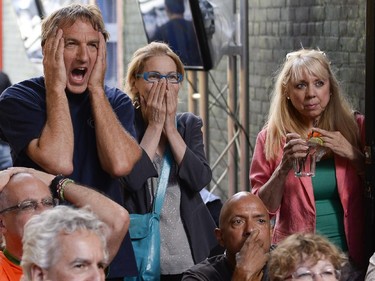 Fans react as they watch the FIFA World Cup 2014 match between Netherlands and Argentina at Hooley's on Wednesday, July 9, 2014.