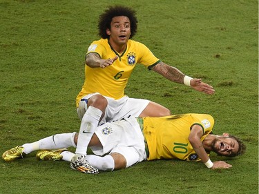 Defender Marcelo shouts for help after Brazil's forward Neymar was injured during the quarter-final football match between Brazil and Colombia at the Castelao Stadium in Fortaleza during the 2014 FIFA World Cup on July 4, 2014. Brazil star Neymar was ruled out of the World Cup after that with a back injury, team doctor Rodrigo Lasmar said. Lasmar told reporters Neymar suffered a fracture in the third verterbra of his back during Brazil's bruising 2-1 quarter-final victory over Colombia.