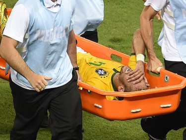 Brazil's forward Neymar is taken out on a stretcher during the quarter-final football match between Brazil and Colombia at the Castelao Stadium in Fortaleza during the 2014 FIFA World Cup on July 4, 2014. Brazil star Neymar was ruled out of the World Cup after that with a back injury, team doctor Rodrigo Lasmar said. Lasmar told reporters Neymar suffered a fracture in the third verterbra of his back during Brazil's bruising 2-1 quarter-final victory over Colombia.