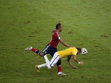 Colombia's defender Juan Camilo Zuniga (L) challenges Brazil's forward Neymar during the quarter-final football match between Brazil and Colombia at the Castelao Stadium in Fortaleza during the 2014 FIFA World Cup on July 4, 2014. Brazil star Neymar was ruled out of the World Cup after that with a back injury, team doctor Rodrigo Lasmar said. Lasmar told reporters Neymar suffered a fracture in the third verterbra of his back during Brazil's bruising 2-1 quarter-final victory over Colombia.