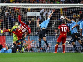 Luis Suarez of Uruguay handles the ball on the goal line, for which he is sent off, during the 2010 FIFA World Cup South Africa Quarter Final match between Uruguay and Ghana at the Soccer City stadium on July 2, 2010 in Johannesburg, South Africa.