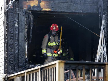 Firefighters battle a rowhouse blaze at 109 Abaca Way in Stittsville (Ottawa), Thursday, July 24, 2014. Two town home were destroyed and another severly damaged. Mike Carroccetto / Ottawa Citizen