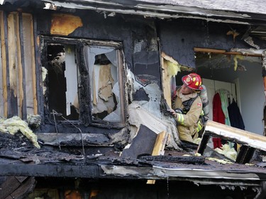 Firefighters battle a rowhouse blaze at 109 Abaca Way in Stittsville (Ottawa), Thursday, July 24, 2014. Two town home were destroyed and another severly damaged. Mike Carroccetto / Ottawa Citizen