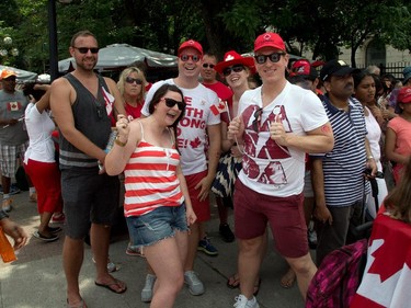 Folks on Wellington Street as people flock to Parliament Hill and the downtown core to enjoy Canada's 147th birthday. Photo taken at 12:51 on July 1, 2014.