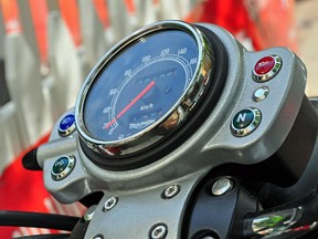 FRIDAY, JULY 2, 2010 PAGE F4 UPLOADED BY: Tim Yip ::: EMAIL: timyip:: PHONE: 780-454-6327 ::: CREDIT: Tim Yip ::: CAPTION: 2010 Triumph Scrambler, basic instrumentation - a speedometer flanked by Neutral, Low Oil, Turn Signal and High Beam warning lights